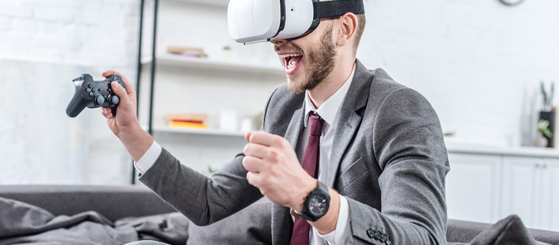 excited-businessman-wearing-virtual-reality-headse-2022-12-16-15-36-42-utc